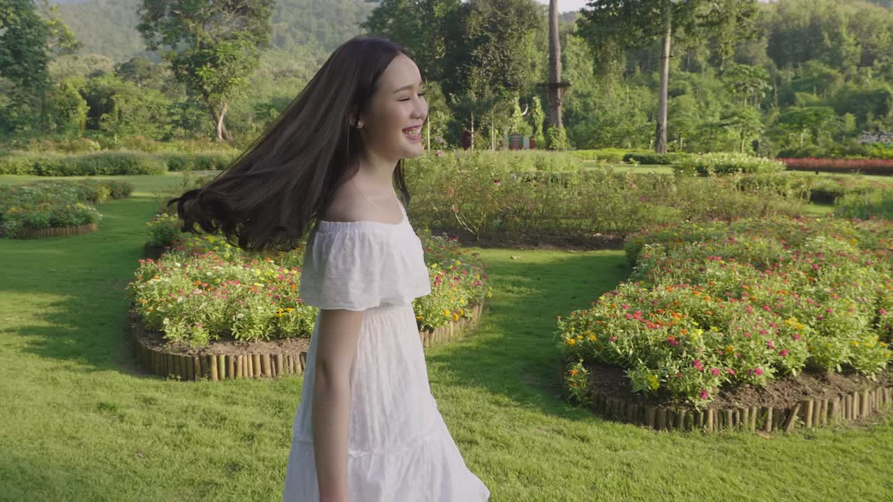 Young Girl Happy In A Garden Of Flowers