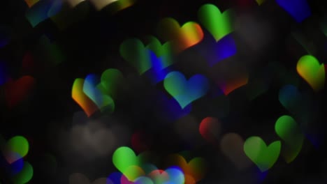 4k diagonal movement of rainbow heart bokeh.