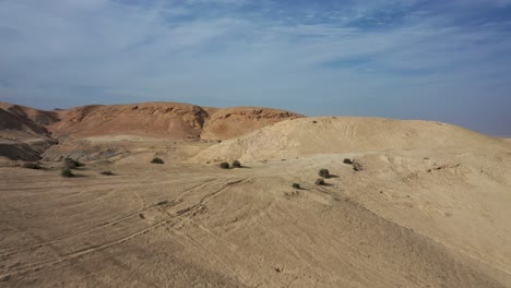 fly-over-yellow-and-red-hills-in-the-Judean-Desert,-Israel,-Drone-shot