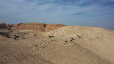 fly over yellow and red hills in the judean desert, israel, drone shot