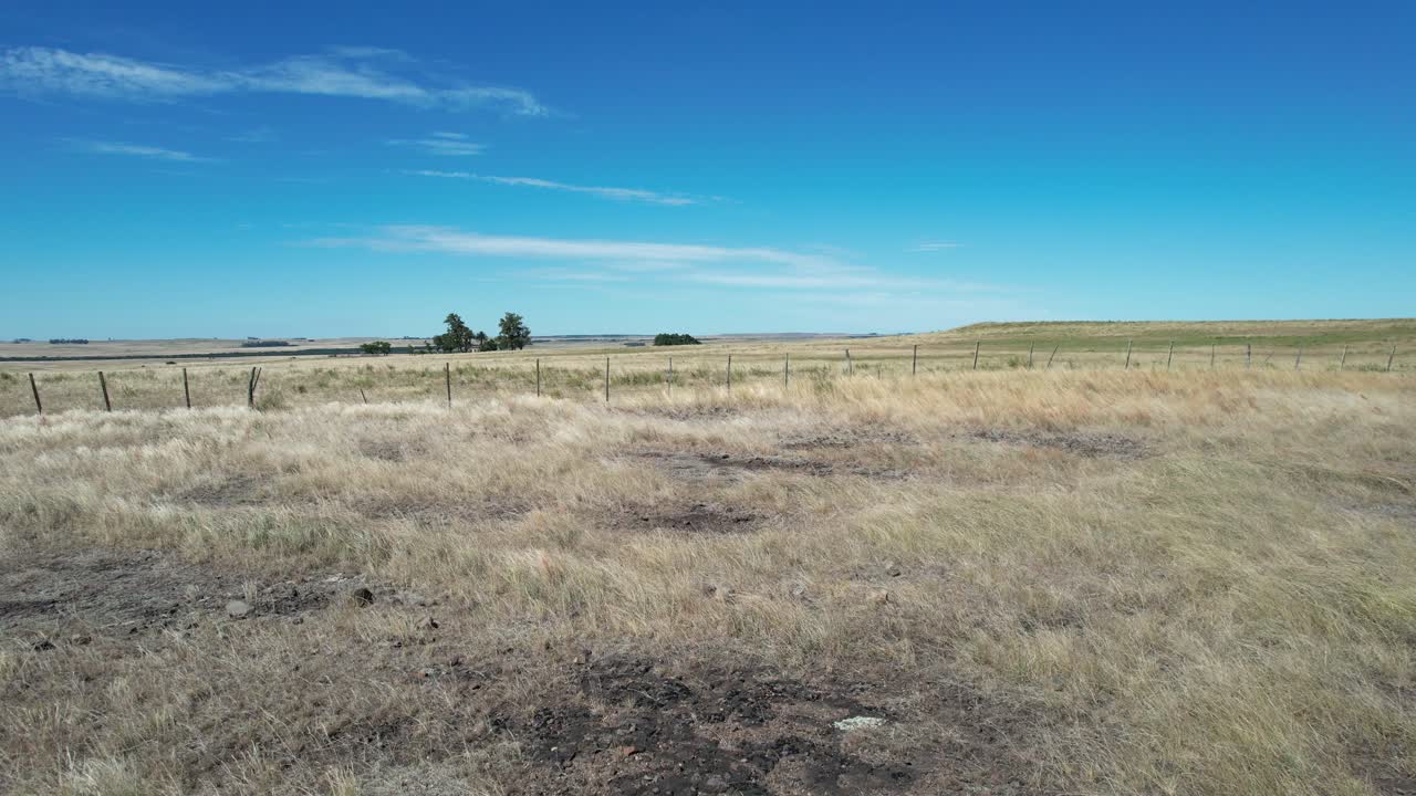 forward movement and lateral tracking with drone in desert field near road