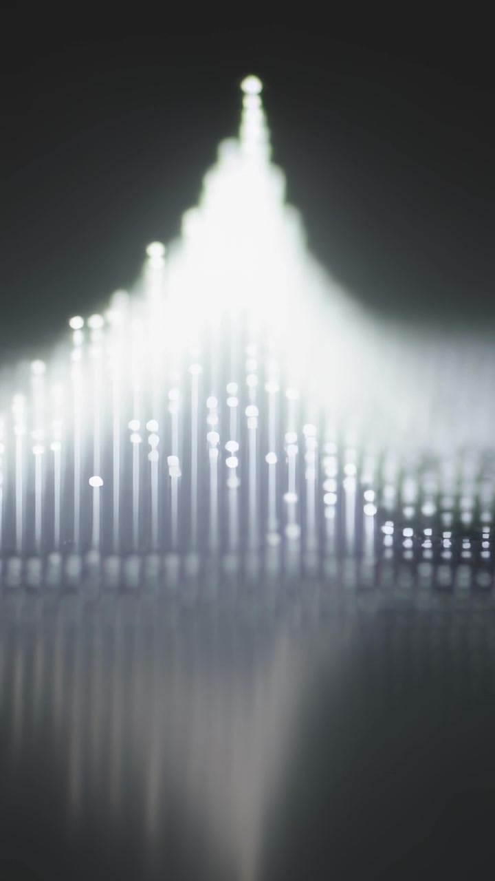 Vertical video: Playback starting LED pins pulsing and brightening in studio closeup, forming peak