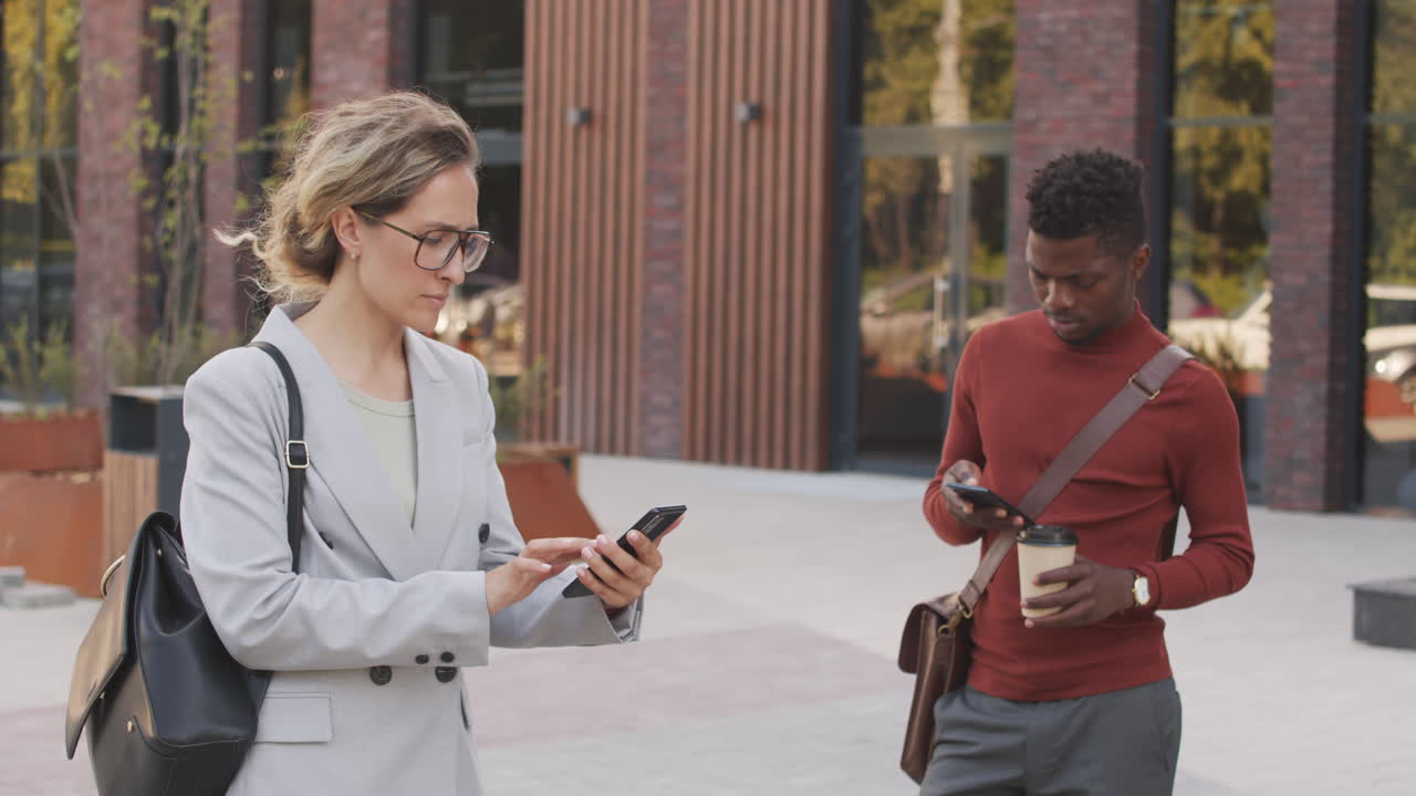 Multi-Ethnic Business People with Smartphones Outdoors
