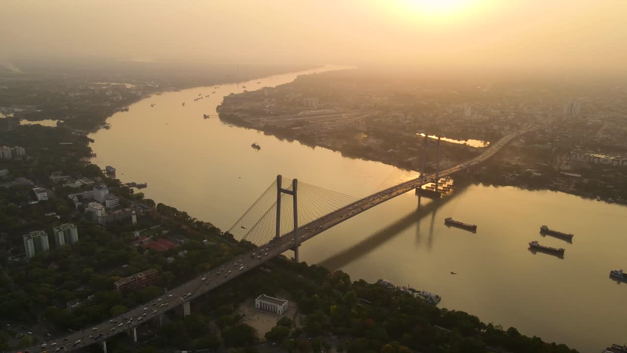Sunset aerial shot of Vidyasagar Bridge, blending urban charm with Kolkata’s picturesque evening skyline.
