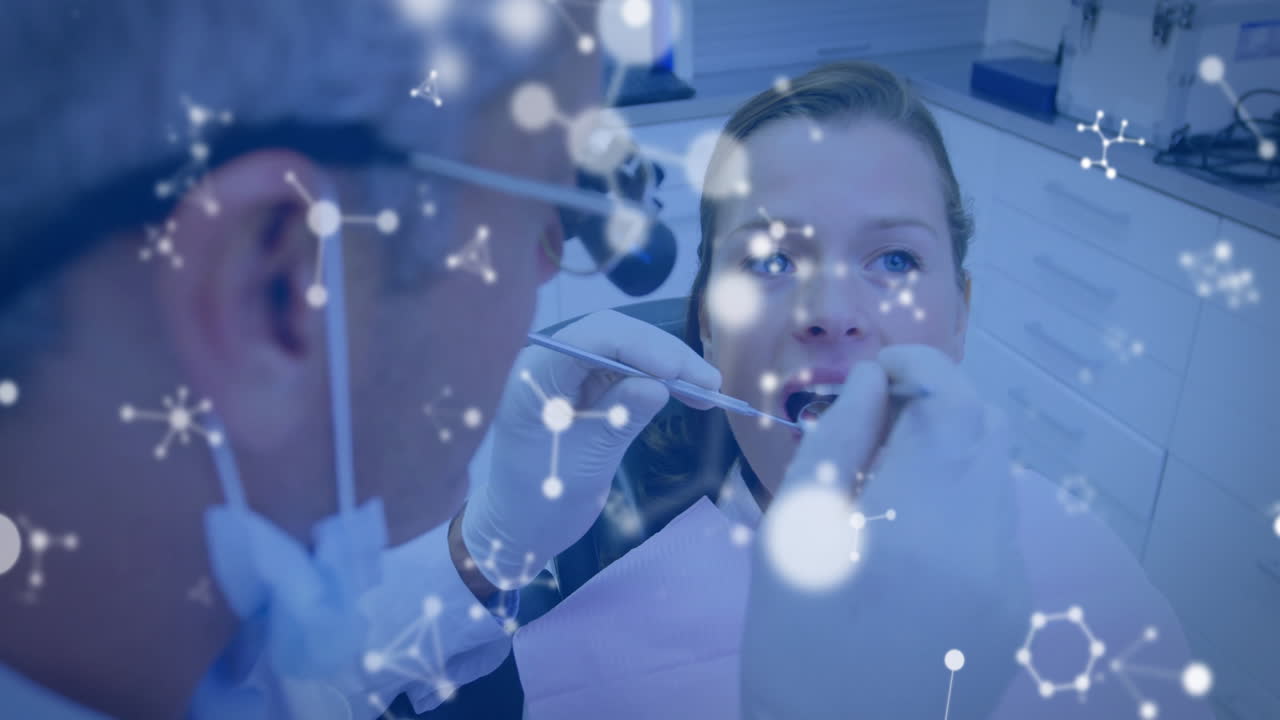 Animation of molecules over caucasian male dentist and female patient
