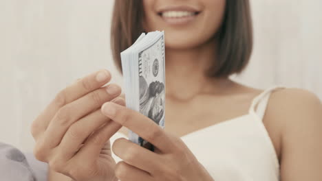 woman celebrating with money