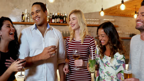 happy friends interacting while toasting a drink glass 4k 4k