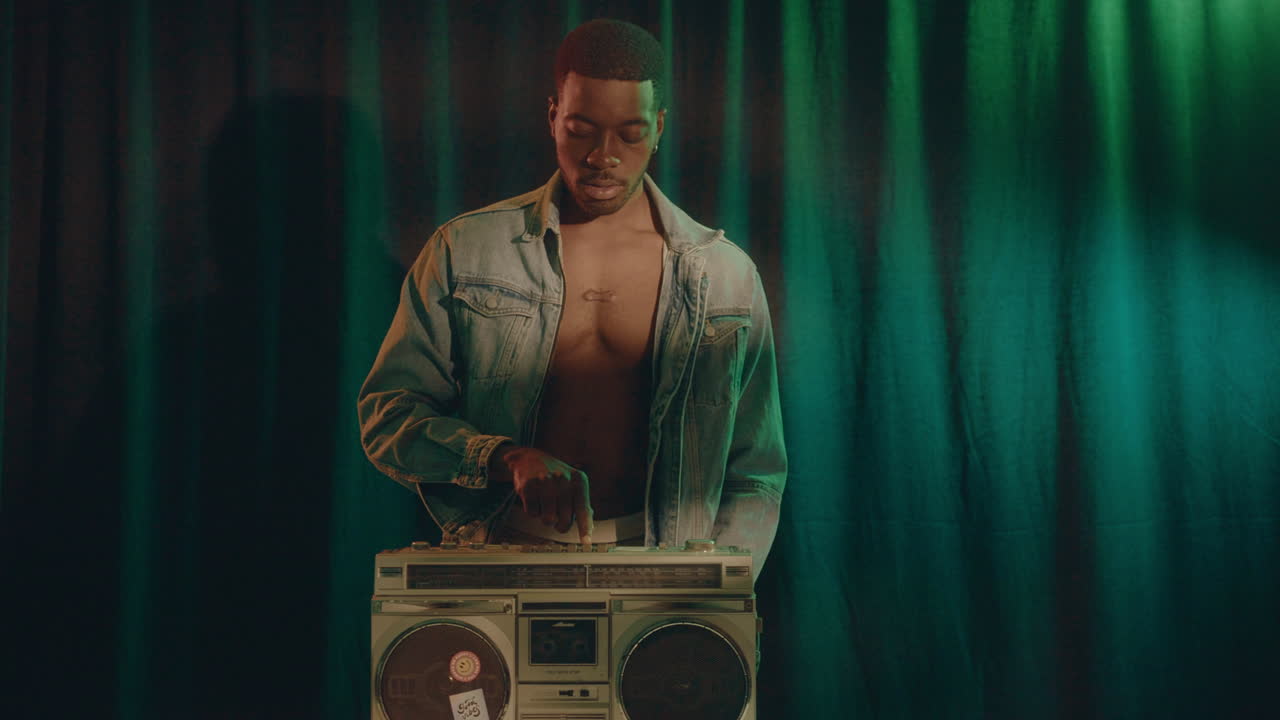 Handsome Black Man Listening Music on Ghetto Blaster