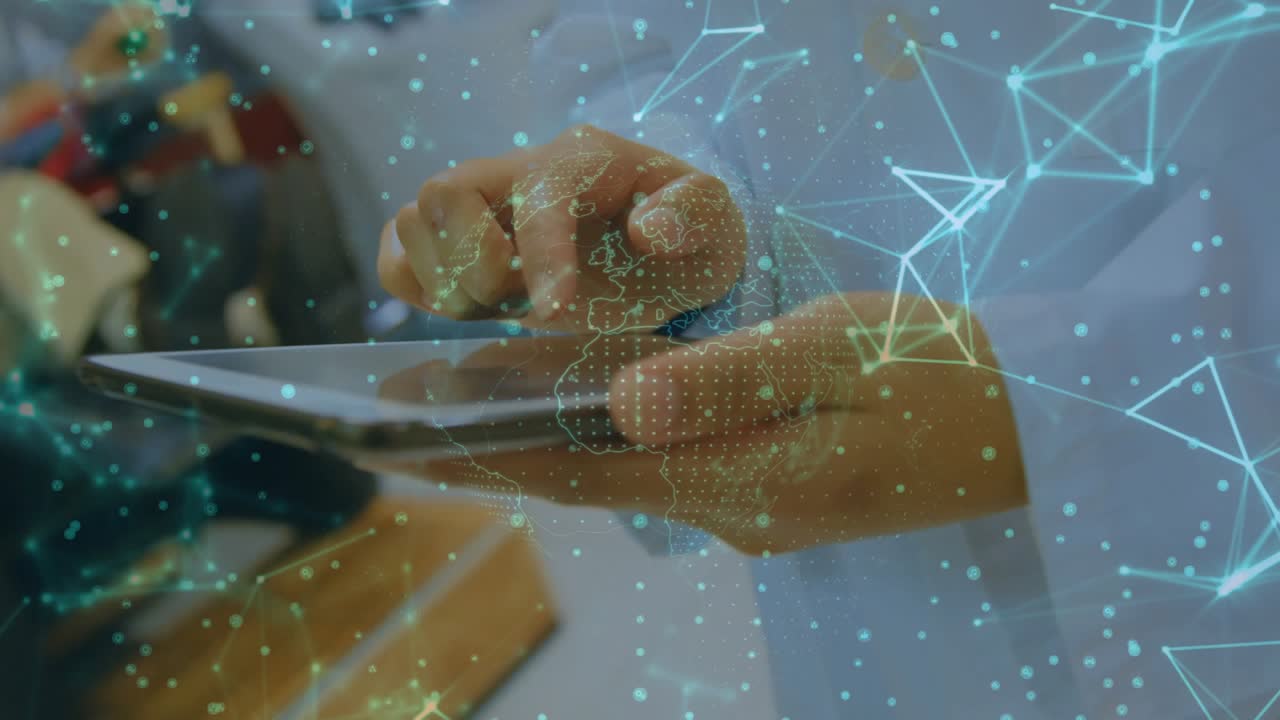 Medic tapping tablet and activating network, camera pulling back revealing manikin for training