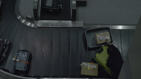 suitcases on luggage conveyor at the airport