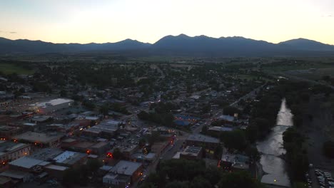 Aerial-cinematic-drone-sunset-late-dusk-evening-pink-clouds-summer-downtown-Salida-Colorado-Buena-Vista-Arkansas-River-Riverside-Park-Scout-surfing-biking-hiking-rafting-Rocky-Mountain-down-motion