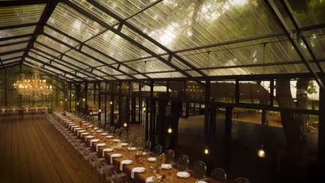 a chandelier at a wedding reception decorated the hall