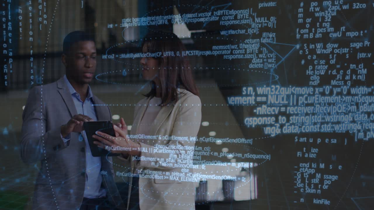 Two tech professionals reviewing data in corridor tapping tablet and scrolling network diagrams