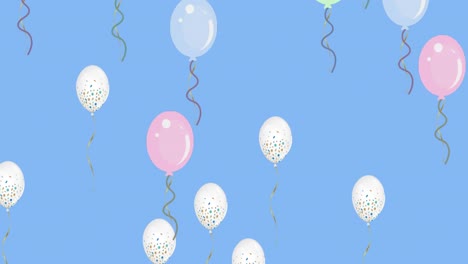 multiple balloons floating against blue sky