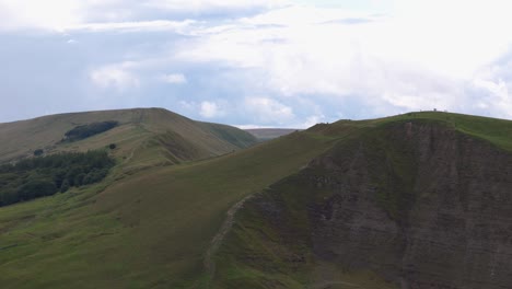 green hills of peak district national park in england - aerial drone shot