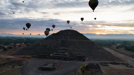 teotihuacan, mexico, sightseeing balloons circling the pyramid of the sun, during sunrise