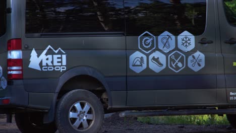 rei co-op sponsored van for outdoor enthusiasts parked in nature