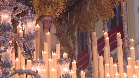 religious ceremony with candles and virgin mary statue