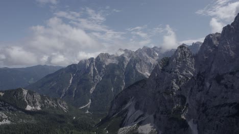 video of a drone with a descriptive plane with recoil over the vrsc pass in slovenia with mountains on the horizon