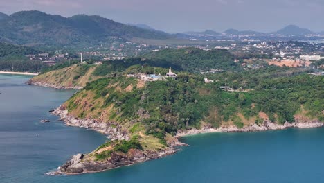 Aerial of Promthep Cape with Lighthouse, scenic lookout in Phuket Island, Thailand coastal landscape