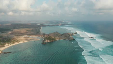 Aerial-of-south-Lombok-coast-filled-with-blue-water-and-tropical-beaches