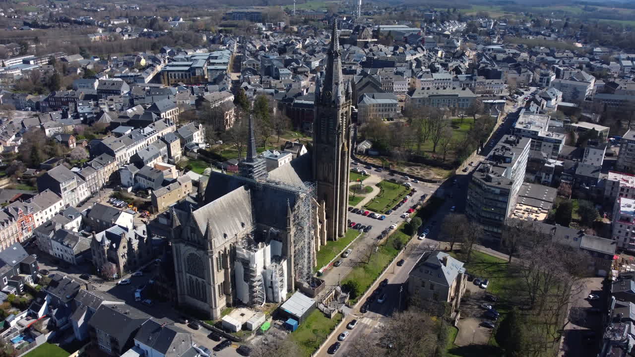 Aerial view of a city with a cathedral under construction