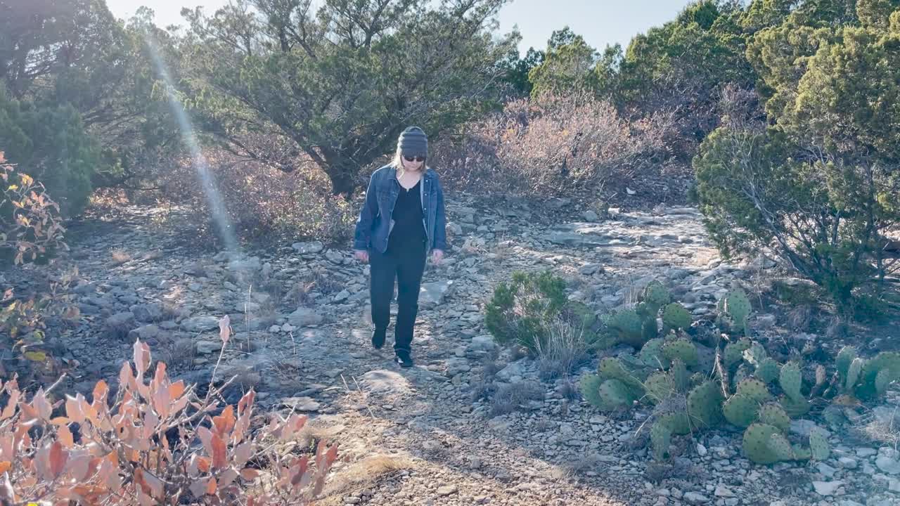 girl on a hike at the top of a mountain