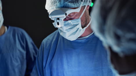 surgeon, team of doctors and tools in operation