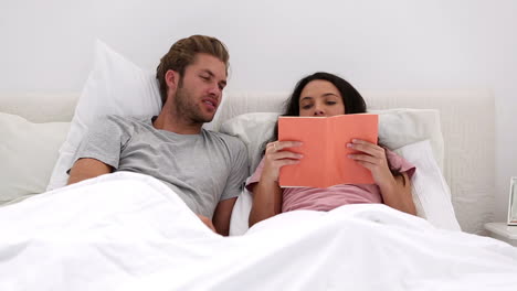 Couple-discussing-a-book-girl-is-reading