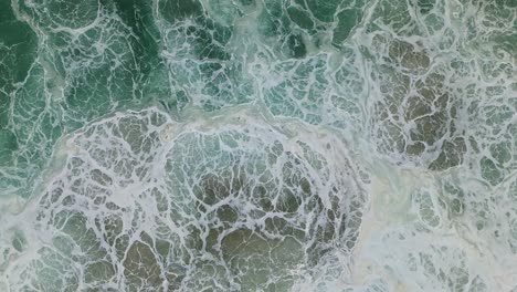top down view ocean powerful foamy waves