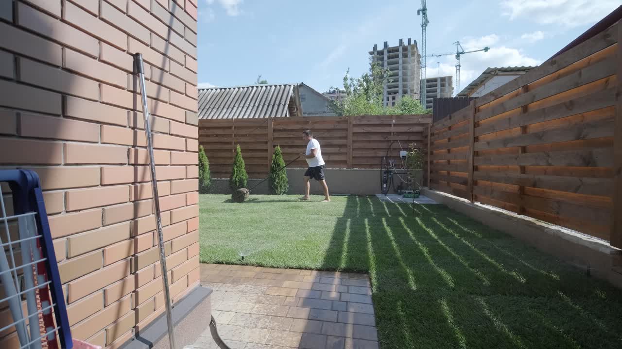 Roll of new natural grass turf installed by professional gardener. Landscaping industry.