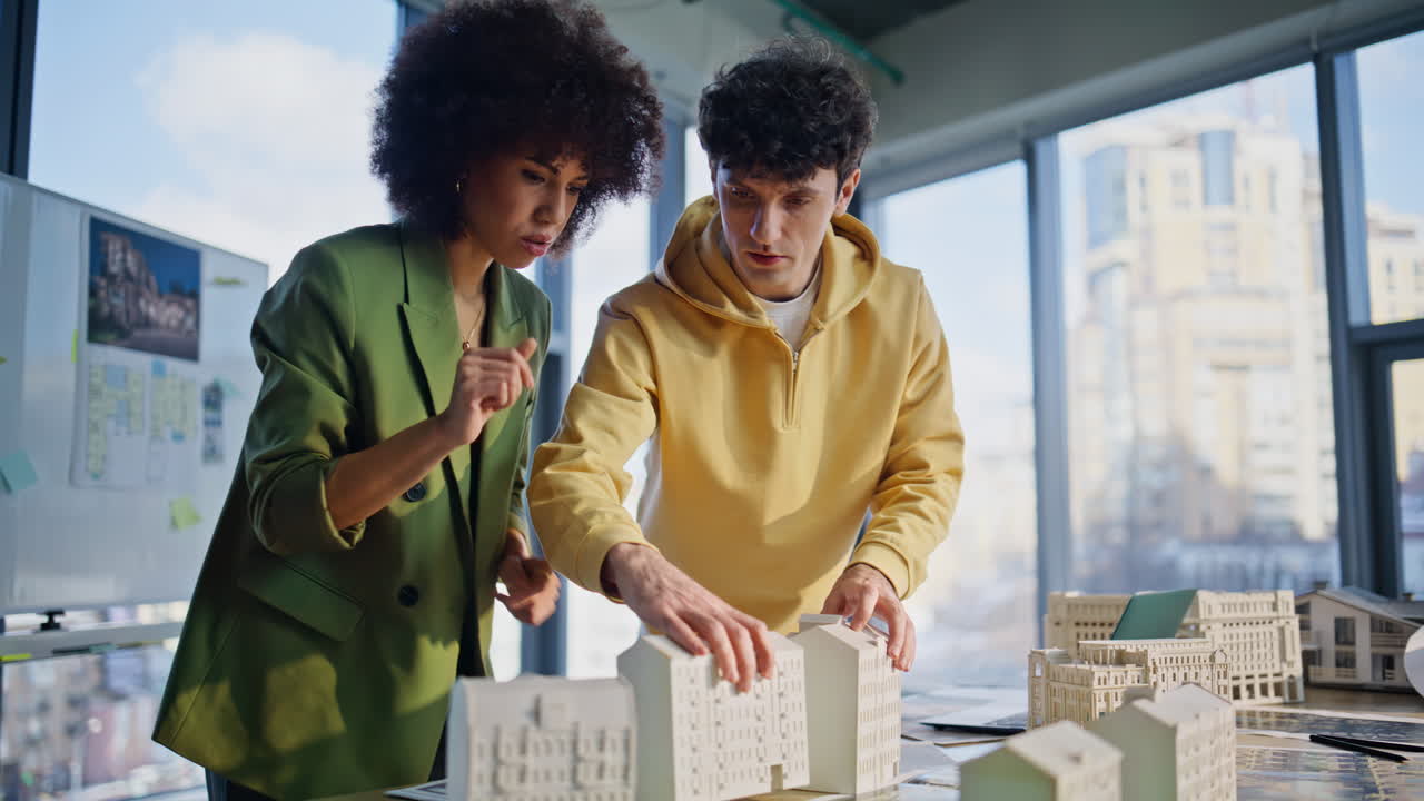 Team architects planning urban constructions project at office workspace closeup