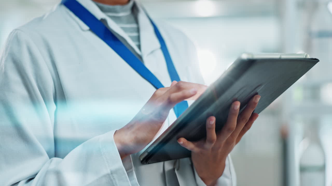 Scientist using a tablet in a lab