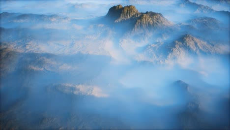 distant mountain range and thin layer of fog on the valleys