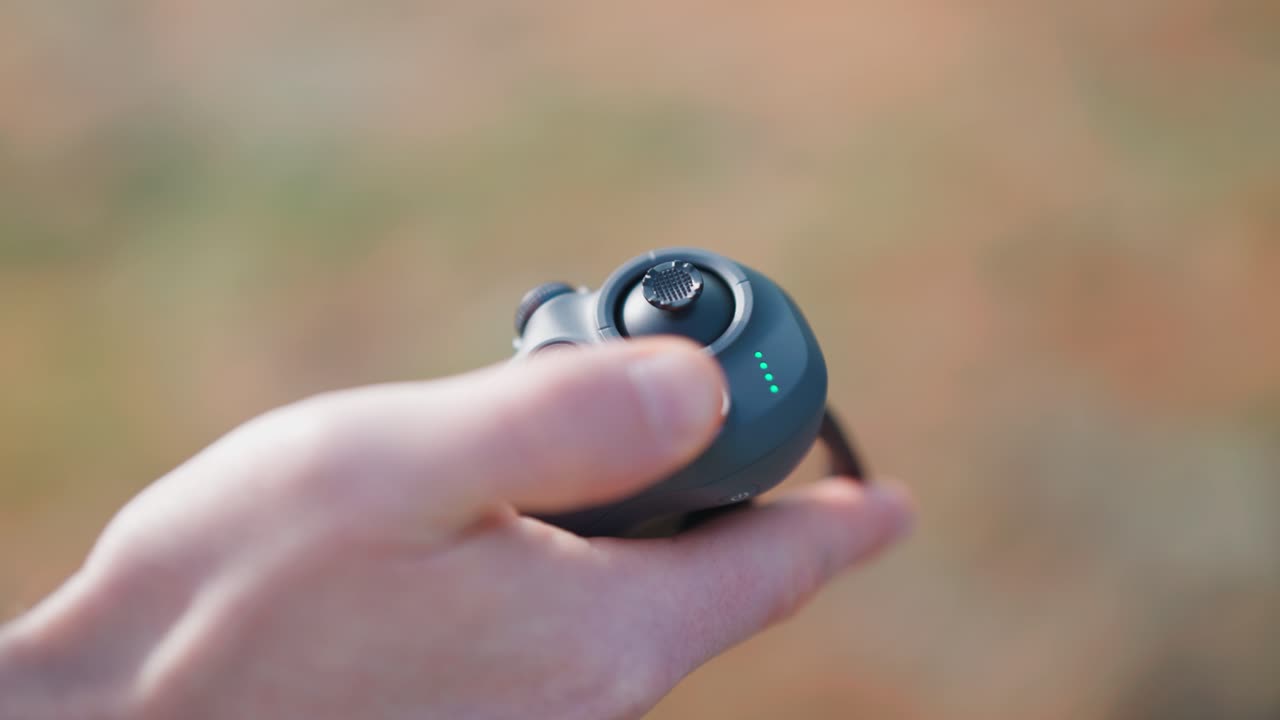 Close up on person hold in hand drone rc motion control and press button