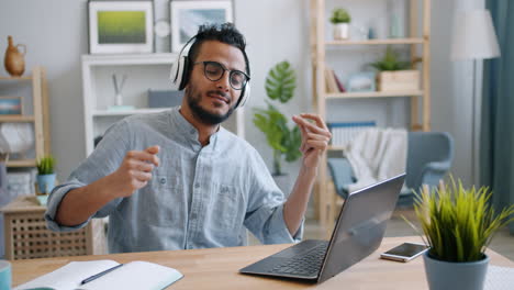 man enjoying an online class with music