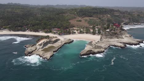 aerial view of klayar beach which has the charm of white sand and beautiful white coral in pacitan, indonesia