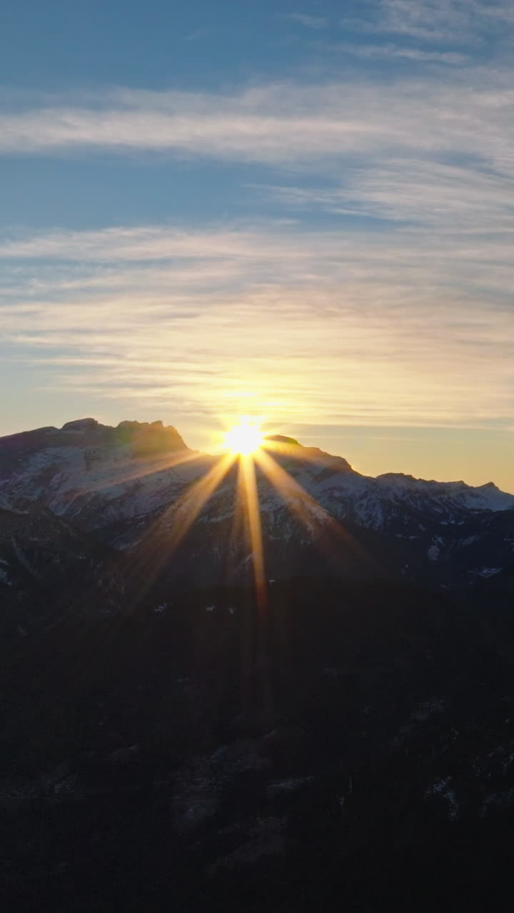 Aerial drone view of the Alleghe village in the province of Belluno, Dolomites, Italy. Vertical