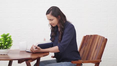 indian girl searching something in book