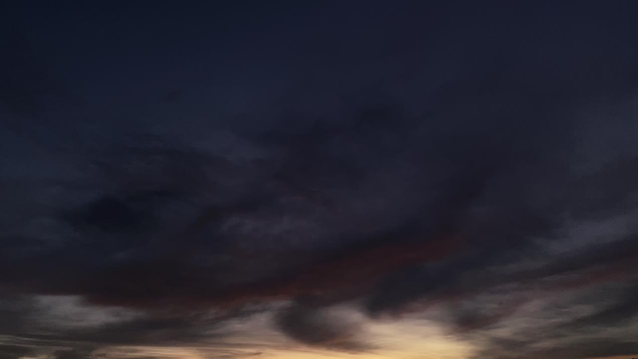 Epic Fantasy Dusk Sunset Fiery Pink Red Clouds and development of dark black sky clouds