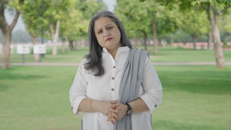 Angry-Indian-mother-looking-to-the-camera-in-park