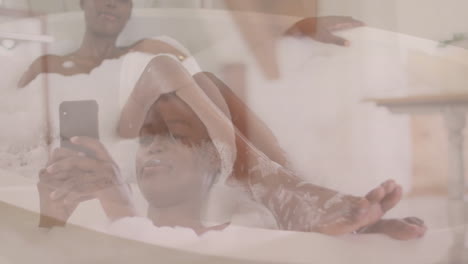 in bubble bath, woman using smartphone, relaxing with animation at home