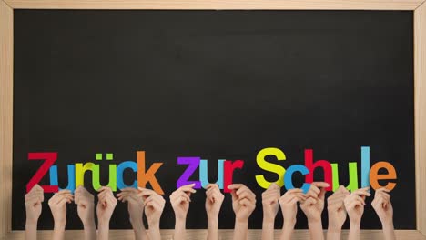 Hands-holding-up-zuruck-zur-schule