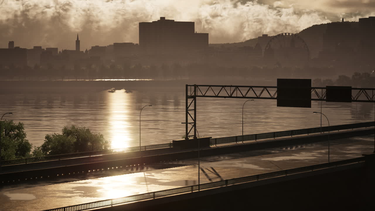 해가 지는 동안 강을 가로지르는 도시 스카이라인과 다리의 전망