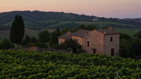 tuscan sunset over vineyards and farmhouses