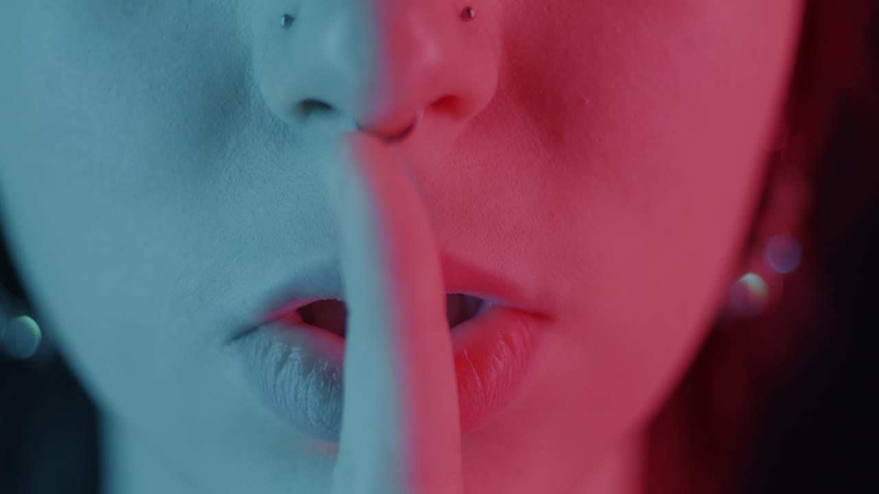 Close-up of a woman's face with neon lighting