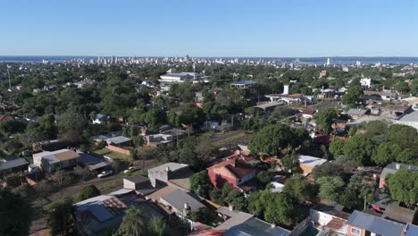 stunning aerial view of posadas city, province of misiones, argentina, showcasing a blend of urban development and lush greenery under a clear blue sky