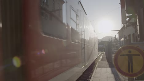 red train at railway station