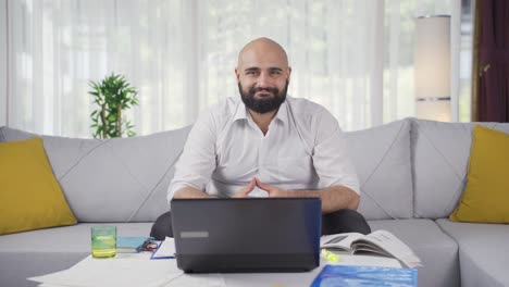 home office worker man nods to the camera.