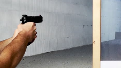 9mm pistol being fired at shooting range